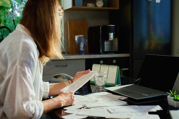A person organizing their financial documents, including bills, bank statements, and receipts, on a desk. The focus is on the act of gathering and sorting essential financial information.