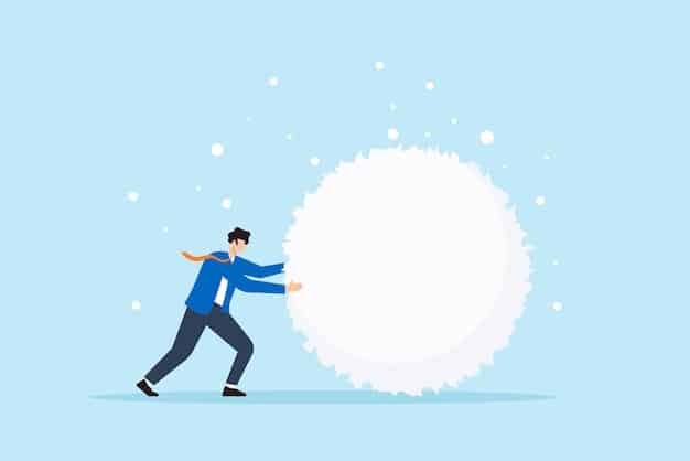 A visual representation of a snowball rolling down a hill, growing larger as it accumulates more snow, symbolizing the increasing payments in the debt snowball method.