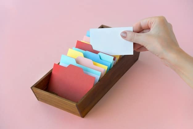 A hand organizing receipts and documents in a file folder labeled 