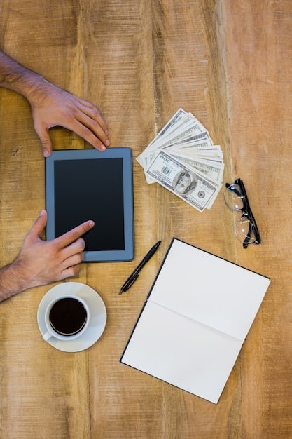 A freelancer reviewing business expenses on a tablet, with a cup of coffee and tax documents scattered around, illustrating the process of planning and reviewing tax deductions.