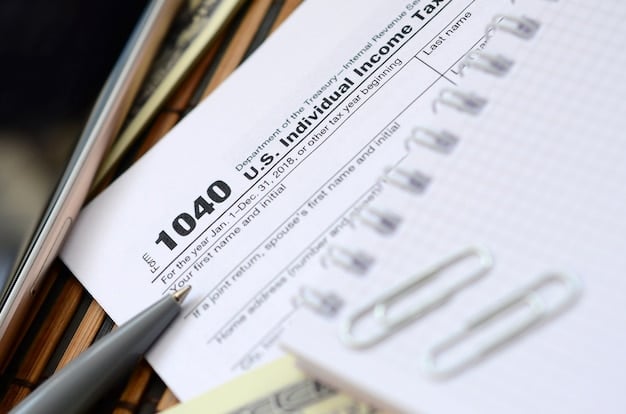 A close-up of a 1098 form (Mortgage Interest Statement) with key sections highlighted, lying on top of a tax return document.