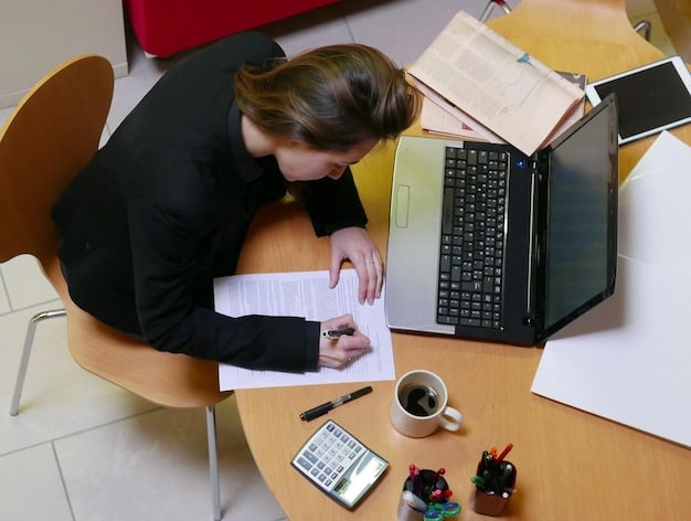 A student completing the FAFSA form on a laptop, with paperwork and financial documents scattered around, symbolizing the application process for Pell Grants. Focus on the screen displaying the FAFSA interface.