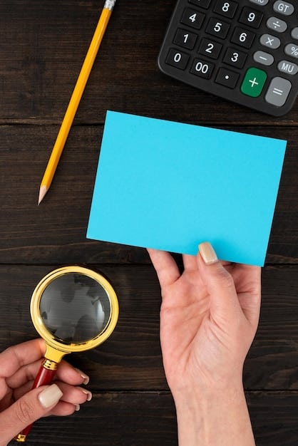 A close-up of a hand holding a magnifying glass over a Social Security card, symbolizing the detailed examination needed to maximize benefits. The background is blurred to focus on the card.