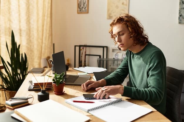 A person sitting at a desk, reviewing documents related to student loans, with a calculator and a pen nearby, emphasizing the process of understanding and managing student debt.
