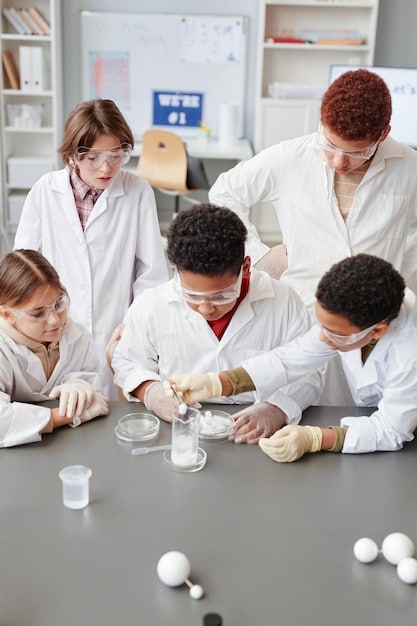 A US veteran in a lab coat conducting research, with beakers and scientific equipment around. In soft focus are other students working.