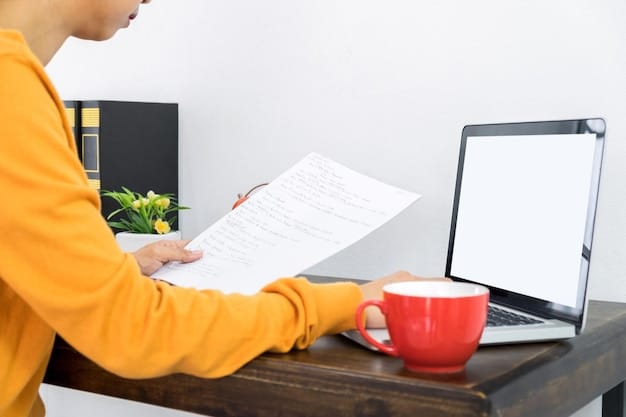 A person sitting at a desk, filling out an online application form on a laptop. The focus is on the laptop screen and the person's hands typing on the keyboard, symbolizing the digital application process for the Affordable Connectivity Program.