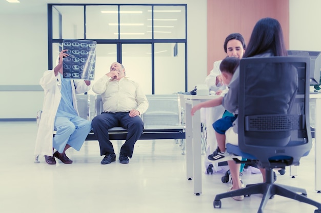 A doctor sitting across from a patient in a modern clinic, discussing healthcare options, symbolizing the doctor visit benefits offered under expanded Medicaid coverage. The image conveys trust and open communication.