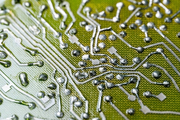 A close-up of a microchip circuit board, symbolizing the intricate technology driving innovation.